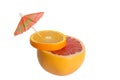 Mix of orange and grapefruit. Citrus cocktail with umbrella. Royalty Free Stock Photo