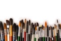 Mix of paint brushes in a row isolated on a white background Royalty Free Stock Photo