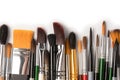 Mix of paint brushes in a row isolated on a white background Royalty Free Stock Photo