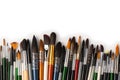 Mix of paint brushes in a row isolated on a white background Royalty Free Stock Photo