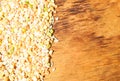 Colorful mixed cereals and legumes: rice, peas, lentils and pearl barley on a wooden background. View from above. Empty space for Royalty Free Stock Photo