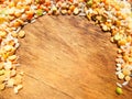 Colorful mixed cereals and legumes: rice, peas, lentils and pearl barley on a wooden background. View from above. Empty space for Royalty Free Stock Photo