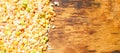 Colorful mixed cereals and legumes: rice, peas, lentils and pearl barley on a wooden background. View from above. Empty space for Royalty Free Stock Photo