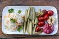 Mix of pickles on a white plate. Sauerkraut, tomatoes, cucumbers and pickled garlic. A traditional appetizing appetizer of Russian Royalty Free Stock Photo