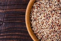 Mix of quinoa grains on dark wooden rustic background