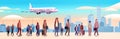 mix race travelers with baggage see airplane flight at airport airplane departure summer vacation concept Royalty Free Stock Photo