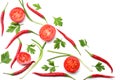 mix red hot chili peppers with parsley and sliced tomato isolated on white background top view Royalty Free Stock Photo