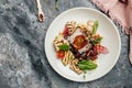 Mix salad with tomatoes and medium beef, grilled vegetables, nuts, sauce and parmesan. Fresh Juicy medium Rare marbled meat veal Royalty Free Stock Photo