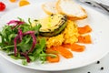 a mix of salmon, arugula salad, white bread and baked avocado with cheese side view Royalty Free Stock Photo