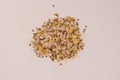 Mix of seeds for a salad. A pile of mixed seeds isolated on white background