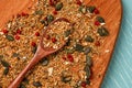 Mix Of seeds and seasonings for salad: pumpkin seeds, rosemary, chia are scattered on a wooden board Royalty Free Stock Photo