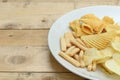 Mix snacks in dish on wood background Royalty Free Stock Photo