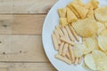 Mix snacks in dish on wood background Royalty Free Stock Photo