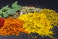 Mix of spices on dark background. Turmeric, paprika