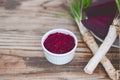 Mix spicy horseradish and beetroot saucer in a small glass jar on a rustic wooden table. Organic food Royalty Free Stock Photo