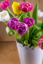 Mix of spring tulips flowers. Bouquet in a vase. Multi-colored spring flower. Gift. Red, pink, white and yellow Royalty Free Stock Photo