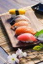 Mix sushi on wood dish, tuna, salmon, sea bass, sweet egg, shrimp sushi, Japanese food Royalty Free Stock Photo