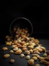 Mix of tasty nuts on dark table