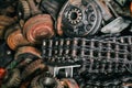 A mix variety garbage of used old rustic mechanic iron and plastic part in the hazy dim factory shallow focus. Royalty Free Stock Photo