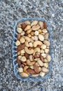 mix of various salted nuts on a glass bowl