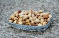 mix of various salted nuts on a glass bowl