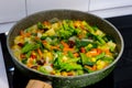 Mix of vegetables fried in a wok. chopped vegetables in a frying pan. selective focus. Royalty Free Stock Photo