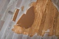 Mix of wood dust, wood varnish, spatula on the floor