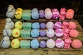 Mixed aromatic bath bombs in display for sale in an window store, in soft focus