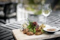 Mixed asian seafood snacks platter on restaurant table