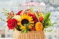 Mixed autumn flowers in basket, bouquet is on the windowsill. Royalty Free Stock Photo