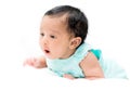 Mixed baby in teal shirt on white background looking at the came