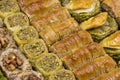 Mixed baklava. Pistachio and walnut baklava. Close-up of baklava in a tray Royalty Free Stock Photo