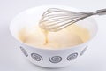 Mixed batter in a bowl and whisk Royalty Free Stock Photo