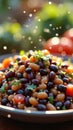 Mixed bean salad with cherry tomatoes and fresh herbs in sunlit garden scene Royalty Free Stock Photo