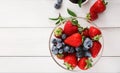 Mixed berries in glass bowls closeup, top view Royalty Free Stock Photo