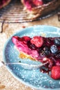 Mixed berries pie on blue ceramic plate Royalty Free Stock Photo