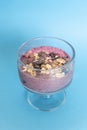 Mixed Berry Acai Smoothie Bowl on a light blue background