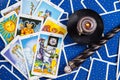 Mixed blue tarot cards with magic ball and candle. Royalty Free Stock Photo