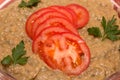 Mixed boiled vegetables in a bowl with tomato