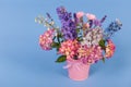 Mixed bouquet flowers on blue background Royalty Free Stock Photo