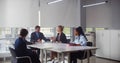 Mixed business people having corporate meeting in board room Royalty Free Stock Photo