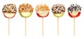 Assorted candy dipped apple lollipops isolated on white