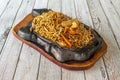 Mixed Chinese curly noodles with sauteed vegetables, with meat and with prawns