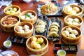 Mixed chinese steamed dumpling dim sum, crab stick, ha gow, seaweed, coriander, noodle, gyoza and garlic for background or Royalty Free Stock Photo