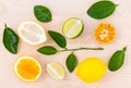 Mixed citruses fruit oranges, lemon and lime on wooden background with orange leaf. Royalty Free Stock Photo