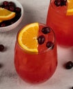 Mixed cocktails with oranges and cranberries