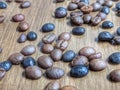 Mixed coffee beans on wooden table