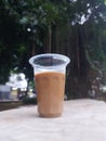 Mixed coffee drink in aqua glass. Looks beautiful taken on the edge of a ditch at Tanjung Duren Park, West JakartaÃ¯Â¿Â¼