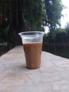 Mixed coffee drink in aqua glass. Looks beautiful taken on the edge of a ditch at Tanjung Duren Park, West JakartaÃ¯Â¿Â¼