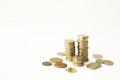 Mixed coin stacks on a white background